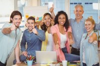 Image of employees giving a "thumbs up"