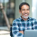 Professional man sitting in front of laptop