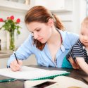 Adult female student with baby on lap 