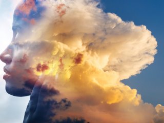 Woman with head in the clouds